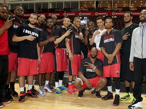 Maybe not the team photo they were hoping for, but Windsor Express gather for one last team shot after the NBL Canada Championship game was "postponed" at WFCU Centre April 30, 2015. (NICK BRANCACCIO/The Windsor Star)