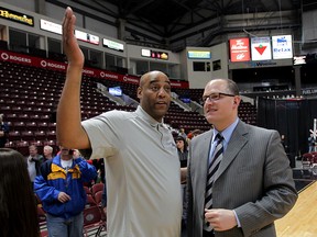 Windsor Express head coach Bill Jones, left, offers an explanation to Windsor Mayor Drew Dilkens after the NBL Canada Championship game against Halifax was "postponed" at WFCU Centre April 30, 2015. (NICK BRANCACCIO/The Windsor Star)