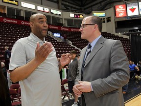 Windsor Express head coach Bill Jones, left, offers an explanation to Windsor Mayor Drew Dilkens after the NBL Canada Championship game against Halifax was "postponed" at WFCU Centre April 30, 2015. (NICK BRANCACCIO/The Windsor Star)
