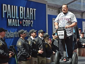 Actor Kevin James arrives on Segway vehicle for the "Paul Blart: Mall Cop 2" New York Premiere at AMC Loews Lincoln Square on April 11, 2015 in New York City.  (Photo by Mike Coppola/Getty Images)