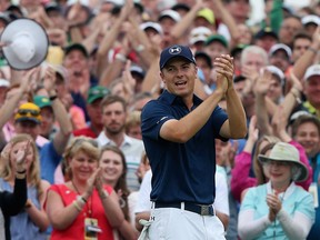 Jordan Spieth of the United States celebrates on the 18th green after his four-stroke victory at the 2015 Masters Tournament at Augusta National Golf Club on April 12, 2015 in Augusta, Georgia.  (Photo by Andrew Redington/Getty Images)