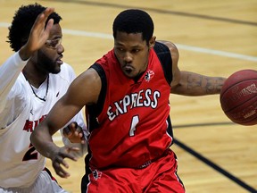 Windsor's Jamarcus Ellis, right, is guarded by Brampton's Zane Johnson in NBL of Canada action at the WFCU Centre Tuesday. (NICK BRANCACCIO/The Windsor Star)