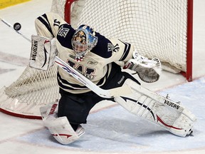 Spits goalie Troy Passingham makes a save against the Saginaw Spirit at the WFCU Centre in 2010.  (TYLER BROWNBRIDGE/The Windsor Star)