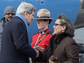 United States Secretary of State John Kerry is greeted by Leona Aglukkaq, Canadian Minister for the Arctic Council, as he arrives Friday, April 24, 2015 in Iqaluit, Nunavut. Ministers from the eight Arctic nations and the leaders of northern indigenous groups attend the Arctic Council Ministerial meeting. THE CANADIAN PRESS/Paul Chiasson