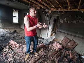 Michael Vigneux, 16, stands in a charred house at 459 Marentette Ave. after an early morning fire, Sunday, April 5, 2015.  Vigneux grew up across the street with his mother. The fire is under investigation for arson.  (DAX MELMER/The Windsor Star)