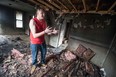 Michael Vigneux, 16, stands in a charred house at 459 Marentette Ave. after an early morning fire, Sunday, April 5, 2015.  Vigneux grew up across the street with his mother. The fire is under investigation for arson.  (DAX MELMER/The Windsor Star)