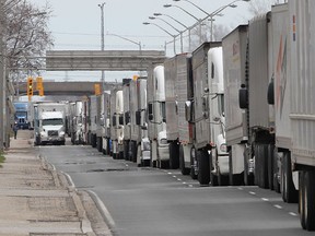 Trucks back up to highway 401in Windsor, Ontario during the closure of the Ambassador Bridge following a vehicle fire. (JASON KRYK/The Windsor Star)