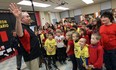 Rob Hanson works with students at M.S. Hetherington School during a recording of O Canada in Windsor on Tuesday, April 7, 2015. Hanson is travelling across Canada to record the voices of close to 30,000 students singing out the national anthem.              (TYLER BROWNBRIDGE/The Windsor Star)