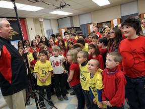 Rob Hanson works with students at M.S. Hetherington School during a recording of O Canada in Windsor on Tuesday, April 7, 2015. Hanson is travelling across Canada to record the voices of close to 30,000 students singing out the national anthem.              (TYLER BROWNBRIDGE/The Windsor Star)