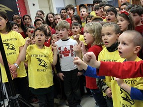 Students at M.S. Hetherington School take part in a recording of O'Canada in Windsor on Tuesday, April 7, 2015. Rob Hanson, from Hometown Music Council, is traveling across Canada to record the voices of close to 30,000 students singing out national anthem.              (TYLER BROWNBRIDGE/The Windsor Star)