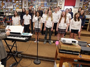 Rose Jobin leads the Holy Names high school choir during a rehearsal at Holy Names in Windsor on Tuesday, April 21, 2015. The group is traveling to New York this weekend to perform at Carnegie Hall.               (TYLER BROWNBRIDGE/The Windsor Star)