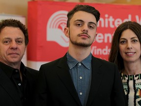 Christian D'Agnillo (centre) with his parents John and Tina at the Volunteer Changing Lives Awards ceremony on April 15, 2015. (Nick Brancaccio / The Windsor Star)