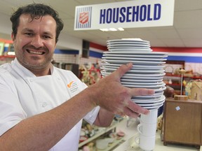 Chef Daryl Neamtu from J. Oulton and Associates makes a donation of hundreds of place settings to the Salvation Army THRIFT STORE on Walker Road in Windsor, Ontario on April 21, 2015. The donation was made on behalf of Berkshire Care Centre in Windsor who are presently updating the dining experience and have purchased new side plates, dinner plates and coffee cups for the residents. More than 25 dozen coffee cups, plates, and other dining items are part of the donation and will available for sale at the Salvation Army Thrift Store. Madisyn Mckee, spokesperson for The Salvation Army said, "We appreciate the support and are grateful for the generous gifts Berkshire Care Centre has donated. The Salvation Army Thrift Store relies on donations and support from organizations and individuals to help generate proceeds for the programs and services of The Salvation Army" (JASON KRYK/The Windsor Star)