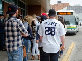 Canadian Tigers fans wait by the dozens at Windsor International Transit Terminal to board tunnel buses for the Detroit Tigers season opener at Comerica Park, Monday April 6. GABRIELLE SMITH/Special to The Windsor Star