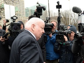 Suspended senator Mike Duffy leaves the courthouse after the second day of his trial in Ottawa on Wednesday, April 8, 2015. THE CANADIAN PRESS/Sean Kilpatrick