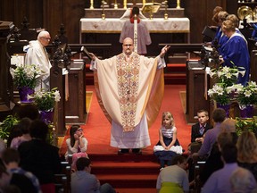 everend Canon Lance Smith leads Easter Mass at the Church of the Ascension on University Ave. West, Sunday, April 5, 2015.  (DAX MELMER/The Windsor Star)