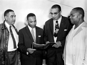 HISTORIC-Aug.7 1956-Rev. Martin Luther King leader of the recent bus boycott in Montgomery Ala. was guest speaker Sunday afternoon at the Emancipation Day celebration at Jackson Park. Left to right is Russel Small, Rev. Martin Luther King, Rev.Theodore Boone and Walter Perry. (The Windsor Star-FILE) USED ONLINE

wallpix-news-historic