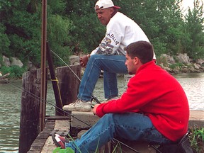 A couple anglers wait for some catfish to bite near Kingsville's Cedar Creek in this 2001 file photo. (Doug Schmidt / The Windsor Star)