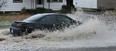 A car plows through the flooded street in the 1900 block of Buckingham Drive in Windsor on Monday, November 29, 2011. Wide spread flooding swept across the city due to heavy rain.                          (TYLER BROWNBRIDGE / The Windsor Star)