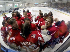The Leamington Flyers celebrate after defeating  the LaSalle Vipers to capture the junior B hockey title Saturday, April 4, 2015, at the Vollmer Complex. (RICK DAWES/The Windsor Star)