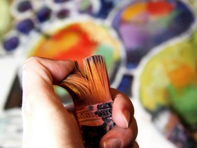 Artist paints picture in cubistic style. Photo by fotolia.com.