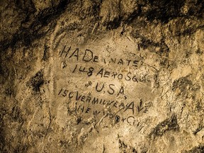 In this image made on Feb. 20, 2015 showing a name engraved on the walls of a former chalk quarry, at the Cite Souterraine, Underground City, in Naours, northern France by HA Deanate, 148th Aero Squadron, USA. 150 Vermilyea Ave, New York City, The names are just some of nearly 2,000 First World War inscriptions that have recently come to light here, a two-hour drive north of Paris, thanks to efforts by Jeffrey Gusky, the site's new owners and local archaeologist Gilles Prilaux. (AP Photo/Jeffrey Gusky)