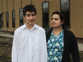 Jacob Mitchell and his mother Rosa leave the Superior Court of Justice on April 20, 2015 in Windsor, Ontario. Jacob is the victim of a hammer attack and the trial is underway for the accused in the attack. (JASON KRYK/ The Windsor Star)