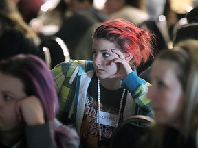 Courtney Jade Lachance, centre, a student at Herman Secondary School is shown on Wednesday, April 29, 2015, at a poverty simulation event at the WFCU Centre in Windsor, ON. (DAN JANISSE/The Windsor Star)