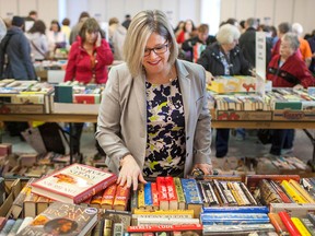 Ontario NDP leader, Andrea Horwath, browses through bins of books at the annual Raise-a-Reader at Windsor Crossing, Saturday, April 11, 2015.   (DAX MELMER/The Windsor Star)