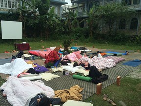 People in Nepal pitch tents on the grass following Saturday's massive earthquake which killed more than 2,500 people. (Photo courtesy of Chloe Grayson)