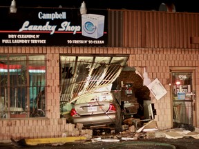 A vehicle crashed through the window of the Campbell Laundry shop at the intersection of Campbell Avenue and College Avenue on Saturday April 24, 2015. (JAY RANKIN/The Windsor Star)