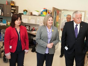 Andrea Horwath, centre, leader of the Ontario New Democratic Party, is joined by MPP's Lisa Gretzky, left, and Percy Hatfield as they tour the John McGivney Children's Centre,Friday, April 10, 2015.  (DAX MELMER/The Windsor Star)