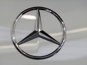 The Mercedes-Benz logo on a vehicle at the Pittsburgh Auto Show is shown in this 2013 file photo. (Gene J. Puskar / Associated Press)