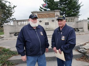 Karl Lovett , left, vice-president and Wayne Hillman, president of the committee are shown at the Boer War Memorial at the Jackson Park in Windsor where many students have taken group photos on the monument.(DAN JANISSE/The Windsor Star)