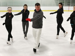 A group of local figure skaters had the chance to share the ice with Canadian Olympic medalist Brian Orser on Friday, April 10, 2015, at the Central Parks Athletics facility in Windsor, ON. Orser instructed over 30 figure skaters for a 3 hour session. The skaters were primarily from the Riverside Skating Club and the Skate LaSalle organization. Orser is shown with some of the skaters during the clinic. (DAN JANISSE/The Windsor Star)