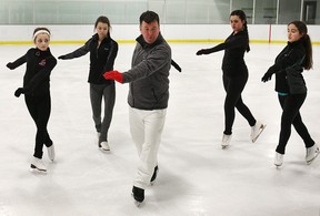 A group of local figure skaters had the chance to share the ice with Canadian Olympic medalist Brian Orser on Friday, April 10, 2015, at the Central Parks Athletics facility in Windsor, ON. Orser instructed over 30 figure skaters for a 3 hour session. The skaters were primarily from the Riverside Skating Club and the Skate LaSalle organization. Orser is shown with some of the skaters during the clinic. (DAN JANISSE/The Windsor Star)