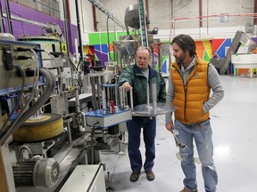 Bob Reaume and Alan Fairweather from Xact Pattern and Fixture, look at machinery up for auction at  Pax-All Manufacturing in LaSalle, Ontario on April 9, 2015.   (JASON KRYK/The Windsor Star)