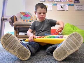 Emmett St.Louis, 5, plays with a toy xylophone at the John McGivney Children's Centre Preschool Program on Tuesday, April 7, 2015, in Windsor. (DAN JANISSE/The Windsor Star)