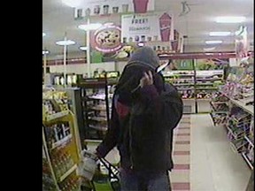A security camera image of a knife-carrying male who robbed the 7-Eleven store on Ottawa Street in Windsor on April 4, 2015. (Handout / The Windsor Star)