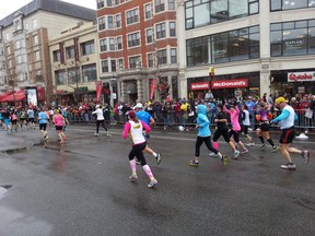 LaSalle's Sheri Radovich all smiles as she finishes the Boston marathon.