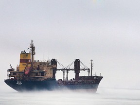 A freighter moves along the misty Detroit River on Thursday, April 9, 2015, in Windsor , ON.   (DAN JANISSE/The Windsor Star)