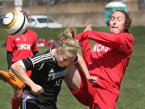Shae Wiggins from Tecumseh Vista Academy, left, collides with Holy Names' Carly Fiorido during the Southwest Ontario Soccer Shootout held in Lakeshore, Ontario on April  24, 2015)  (JASON KRYK/The Windsor Star)