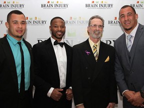 Athletes and event speaker from left to right, Tarrence Crawford of the Windsor Lancers, Daryl Townsend of the Montreal Alouettes, Ernie Soulliere and Tyrone Crawford of the Dallas Cowboys attend the second annual Sports and Sparkle gala, Saturday, April 11, 2015, at the Caboto Club. The event was hosted by the Brain Injury Association to raise funds and awareness. (RICK DAWES/The Windsor Star)