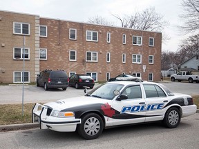 A Windsor police cruiser is parked outside an apartment building at Ford Blvd. and Wyandotte St. East, Sunday, April 5, 2015.  (DAX MELMER/The Windsor Star)