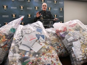 Chief of Windsor police Al Frederick looks over the medications and pharmaceuticals collected by Crime Stoppers at the most recent Take Back Your Drugs event. Photographed at Windsor police headquarters, April 20, 2015. (Dan Janisse / The Windsor Star)