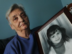 Paula Topic holds a portrait of her daughter Ljubica Topic, who was murdered, at her home in Windsor on Friday, April 17, 2015. Police have released the fact that a tooth was found at the scene of the murder in hopes someone will come forward with new information in the 44 year old case.              (TYLER BROWNBRIDGE/The Windsor Star)
