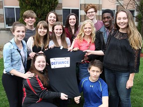 Walkerville Collegiate Institute students are working to raise $20,000 to honour Rob Baxter, a popular teacher who died suddenly in March. They are setting up a scholarship in his name and helping fund a school in Ethiopia. Some of the students working on the project are shown, kneeling, Megan Power and Lucas Bandak, standing, middle row, Mackenzy Metcalfe, Madeline Doornaert, Delaney Beaudoin, Allie Bachtold and Kara Kristof, back row, Andrew Metcalfe, Abbie Guignard, Maddison Beaudoin, Tim Maitland and William Manroe. (DAN JANISSE/The Windsor Star)