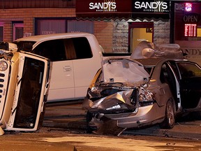 Wrecked vehicles including a white Jeep Wrangler in the 7000 block of Wyandotte Street East on the night of Mar. 31, 2015. (Nick Brancaccio / The Windsor Star)