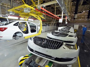 This picture taken on Jan. 28, 2015 shows Buicks being assembled at Wuhan auto plant in Wuhan, central China’s Hubei province. (AFP / Getty Images files)