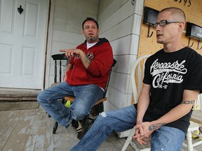 Jay Sales and Trevor Smith discuss their feeling about living in Windsor of a porch in the west end of Windsor on Monday, April 20, 2015. A recent survey shows many Windsorites ranked their quality of life in the city as low. (TYLER BROWNBRIDGE / The Windsor Star)